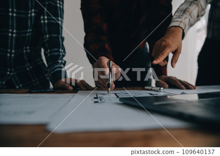 Two business man construction site engineer. Engineering objects on workplace with partners interacting on background 109640137