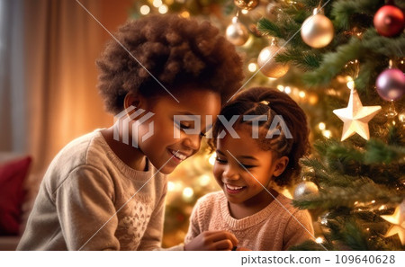 happy overjoyed adorable african american child girl decorating Christmas tree with happy Brother, putting toys on branches, enjoying preparing for New Year celebration at home, miracle time concept. happy overjoyed adorable african american child girl decorating Christmas tree with happy Brother, putting toys on branches, enjoying preparing for New Year celebration at home, miracle time concept. 109640628