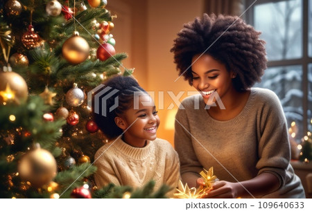 happy optimistic adorable african american beautiful woman decorating Christmas tree with happy Sister, putting toys on branches, enjoying preparing for New Year celebration home, miracle time happy optimistic adorable african american beautiful woman decorating Christmas tree with happy Sister, putting toys on branches, enjoying preparing for New Year celebration home, miracle time 109640633