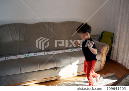 A boy with autism is flapping. 109641203