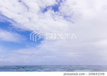 Ocean water is under blue sky with white clouds Ocean water is under blue sky with white clouds 109641549