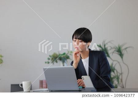Business woman with a tired expression 1 109642377