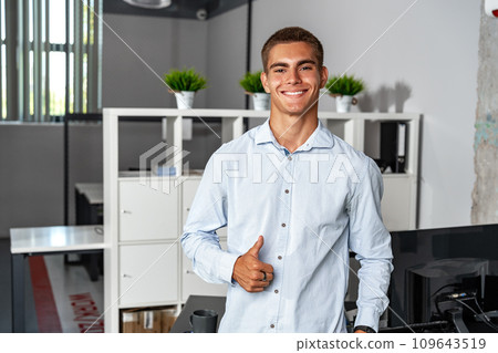 Portrait of handsome young male entrepreneur in the office Portrait of handsome young male entrepreneur in the office 109643519