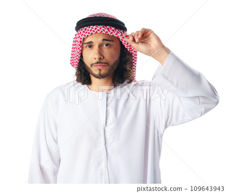 Portrait of a young Arab man wearing middle-eastern traditional dress thobe isolated on white 109643943