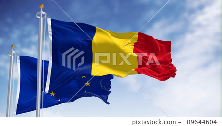 Romania and European Union flags waving in the wind on a clear day 109644604