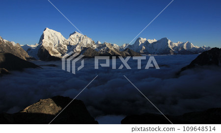 Mountain ranges of the Himalayas and sea of fog. View from Gokyo Peak, Nepal. 109648514