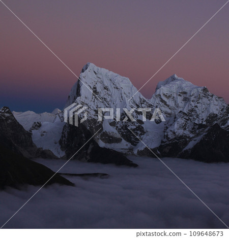 Nightfall in the Himalayas. Mount Cholatse and Tobuche, Nepal. Nightfall in the Himalayas. Mount Cholatse and Tobuche, Nepal. 109648673