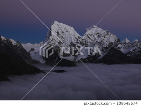 Purple sky over Mount Cholatse and Tobuche, Nepal. Purple sky over Mount Cholatse and Tobuche, Nepal. 109648674