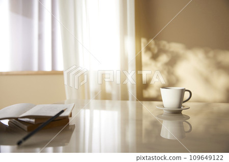 A cozy, bright room with sunlight streaming in. 109649122