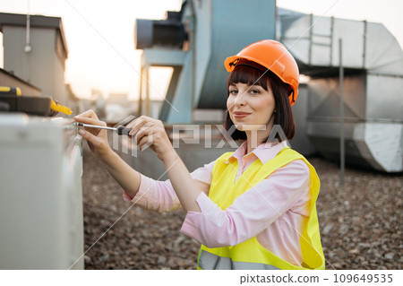 Focused female tightening bolt on cooling system outdoors 109649535