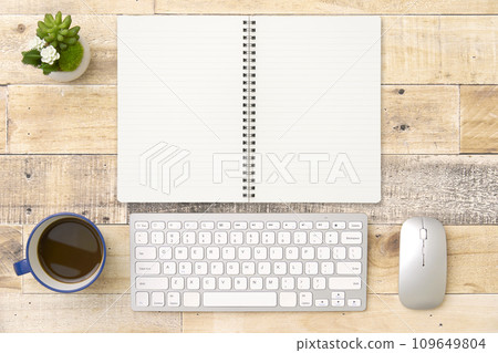 Notebook on desk overhead shot Notebook on desk overhead shot 109649804