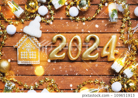 House key with keychain cottage on festive brown wooden background with stars, lights of garlands. New Year 2024 wooden letters, greeting card. Purchase, construction, relocation, mortgage, insurance House key with keychain cottage on festive brown wooden background with stars, lights of garlands. New Year 2024 wooden letters, greeting card. Purchase, construction, relocation, mortgage, insurance 109651913