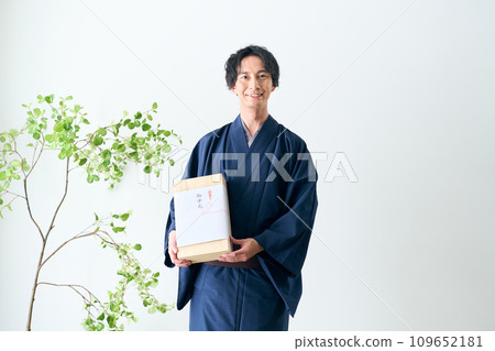 A man offering a midyear gift A man offering a midyear gift 109652181