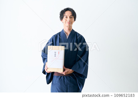 A man offering a midyear gift A man offering a midyear gift 109652183