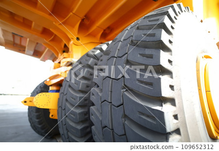 Huge rear wheels of dump truck at unusual angle Huge rear wheels of dump truck at unusual angle 109652312