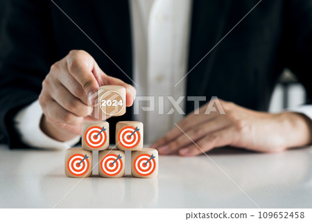 2024 goals of business or life. Wooden cubes with 2024 and goal. Starting to new year. Business common goals for planning new project, annual plan, business target achievement. 109652458