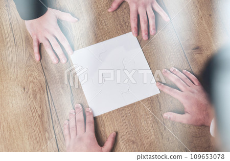 Above view of business team looking at paper during meeting and discussing it Above view of business team looking at paper during meeting and discussing it 109653078