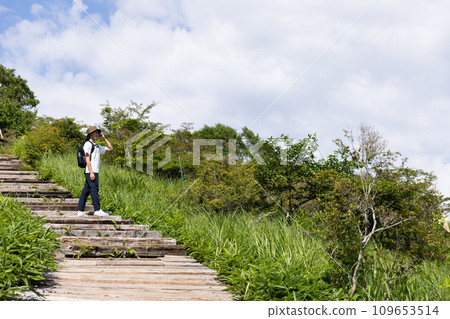 Young man enjoying a hike Young man enjoying a hike 109653514