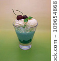 Image of melon drink in blue. Smoothie. milkshake. ice cream and cherries on top Image of melon drink in blue. Smoothie. milkshake. ice cream and cherries on top 109654868