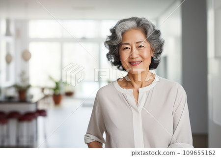 Portrait of a smiling elderly Asian woman. AI generated. 109655162