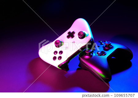 Gaming joystick on black background in neon light Gaming joystick on black background in neon light 109655707