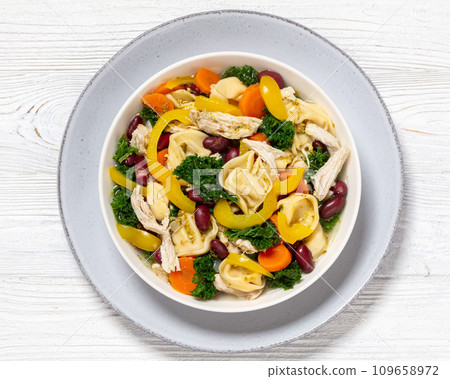 chicken minestrone soup with tortelloni in bowl 109658972
