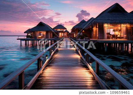 Bungalows for summer vacation vacations on the ocean on sunset. Tropical holidays 109659461