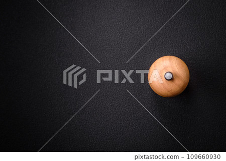 Beautiful wooden figured pepper shaker or salt shaker with a mill 109660930