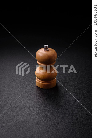 Beautiful wooden figured pepper shaker or salt shaker with a mill 109660931