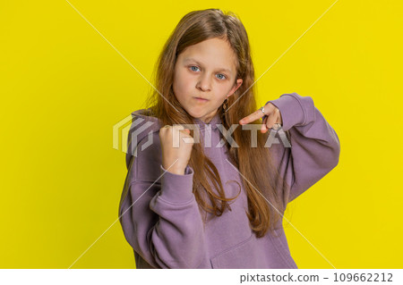 Aggressive angry child girl trying to fight at camera, shaking fist, boxing, punishment, threaten 109662212