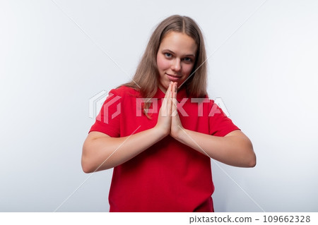 Kind teenage girl smiling and friendly against a background with copy space 109662328
