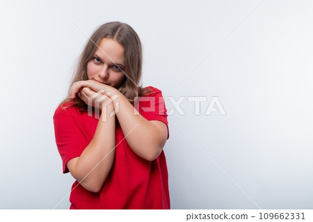 A European teenage girl is thinking about something 109662331