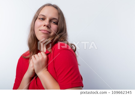 Dreamy teenager girl thinking on a white background Dreamy teenager girl thinking on a white background 109662345
