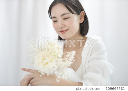 young woman with white bouquet young woman with white bouquet 109662381