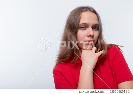 Caucasian girl with brown hair is wearing a red T-shirt Caucasian girl with brown hair is wearing a red T-shirt 109662421