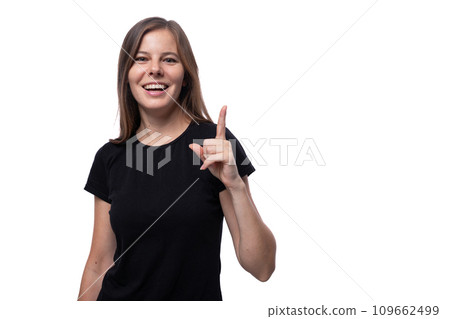 Positive young woman with brown hair wearing a black T-shirt on a white background 109662499