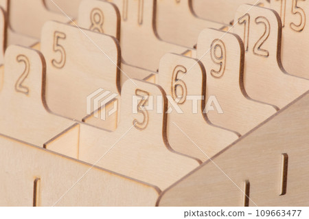 Numbered Sections Figures for Storage of Objects and Parts Made of OSB Material Signs and Symbols Close-up Detail Macro Numbered Sections Figures for Storage of Objects and Parts Made of OSB Material Signs and Symbols Close-up Detail Macro 109663477