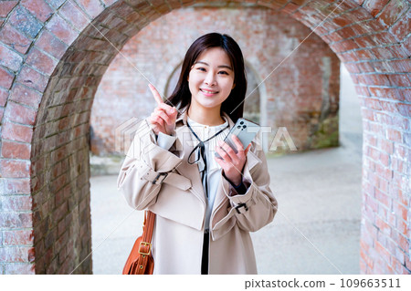 A young woman sightseeing in Kyoto smartphone A young woman sightseeing in Kyoto smartphone 109663511
