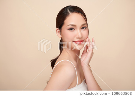 Beautiful young asian woman with clean fresh skin on beige background, Face care, Facial treatment, Cosmetology, beauty and spa, Asian women portrait. 109663808