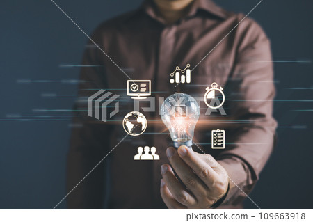 person hand holding power lightbulb and pretend to think, inspiration, creativity and imagination concept, innovation technology success business. Digital transformation. Ai technology. 109663918