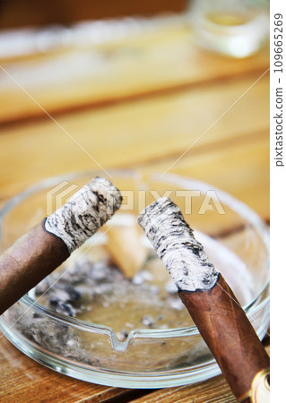 smoking cigars as bad unhealthy relaxation 109665269