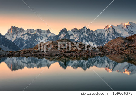 Lac Blanc with Mont Blanc mountain range and male tourist reflect on the lake in French Alps at Chamonix, France 109666373