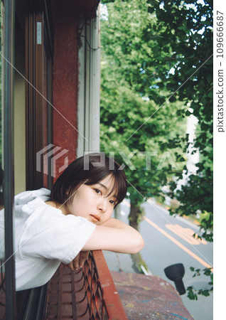 Young woman on the veranda 109666687