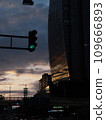 Wall of a building reflecting orange light at dusk 109666893