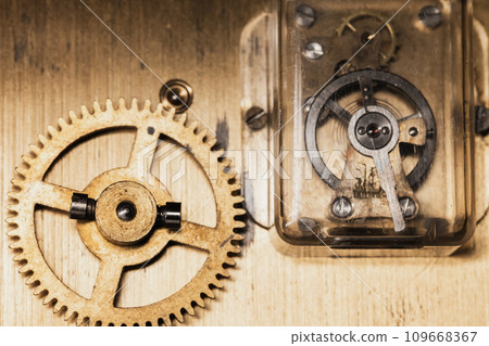 Balance wheel of a mantel clock, closeup Balance wheel of a mantel clock, closeup 109668367