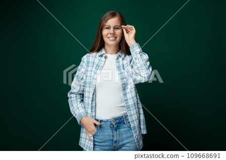 Young European woman with brown eyes dressed in casual comfortable clothes Young European woman with brown eyes dressed in casual comfortable clothes 109668691