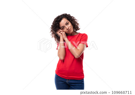 young caucasian active leader woman with black curly hair dressed in red t-shirt with fabric print young caucasian active leader woman with black curly hair dressed in red t-shirt with fabric print 109668711