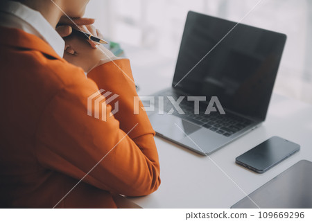 Audit concept,Administrator business man financial inspector and secretary making report calculating balance. Internal Revenue Service checking document. 109669296
