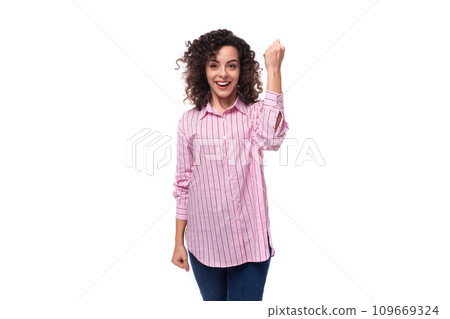 young leader woman with curly hair dressed in a pink shirt and jeans young leader woman with curly hair dressed in a pink shirt and jeans 109669324