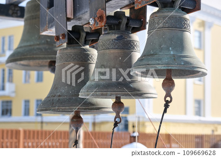 bells and religious symbols made from metal  109669628